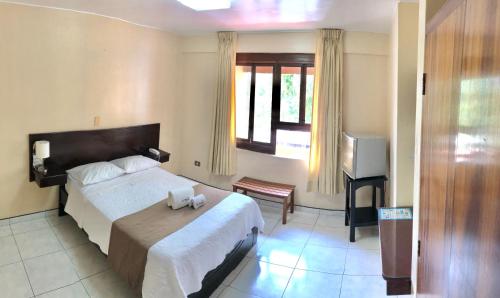 Postel nebo postele na pokoji v ubytování Hotel Monte Azul