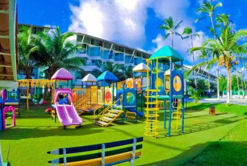 a playground in a park with a slide at Ancorar Porto de Galinhas Flats in Porto De Galinhas
