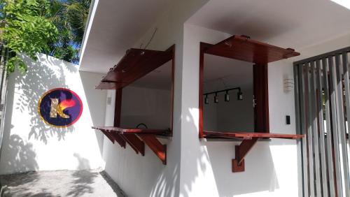a bathroom with a mirror on a wall at KiteBar Hotel in Cumbuco