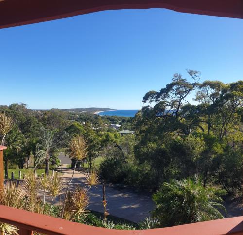 a view from the balcony of a house with trees at Escape 1770 Motel - No Kids - NO SMOKING - No Partying in Agnes Water