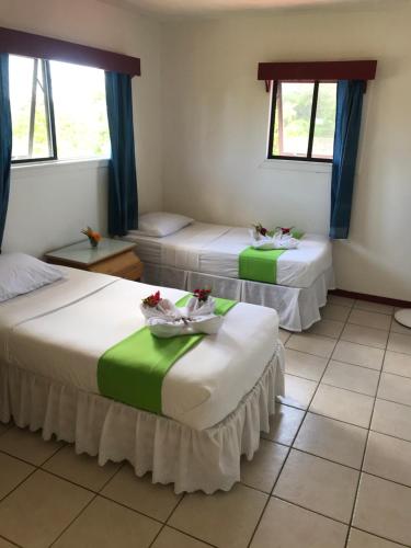 Letto o letti in una camera di Tonga Holiday Villa