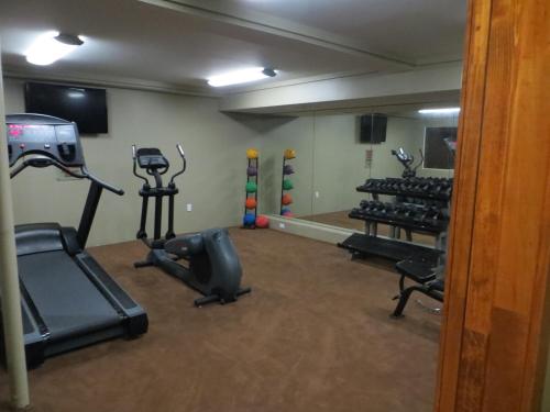 a gym with cardio equipment in a room at The Mammoth Creek Inn in Mammoth Lakes