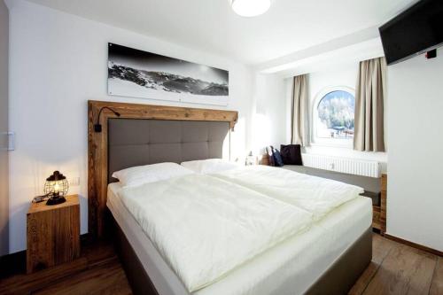 Postel nebo postele na pokoji v ubytování Appartements Austria