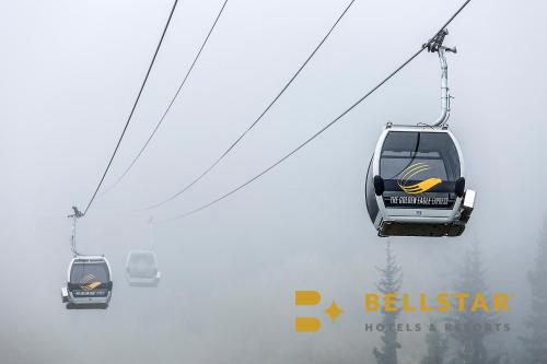 two lifts in the sky in the fog at Palliser Lodge — Bellstar Hotels & Resorts in Golden
