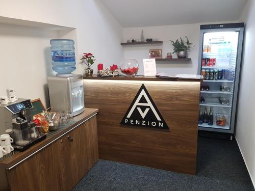 a bar with a sign on the side of it at AV Penzion in Olomouc