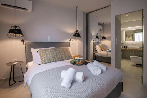 a bedroom with a bed with towels on it at Ermou Monastiraki View Lycabettus in Athens