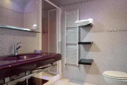 a bathroom with a sink and a toilet at Relais Stibbert Florence in Florence