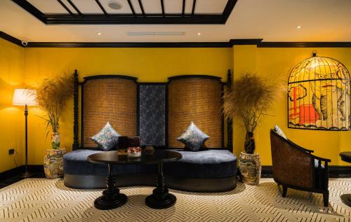 a hotel room with a bed and a table at Solaria Hanoi Hotel in Hanoi