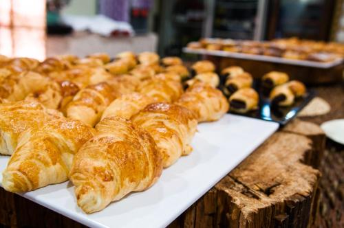a bunch of croissants and other pastries on a table at Hotel Balneario Areatza Nº 01224 in Areatza