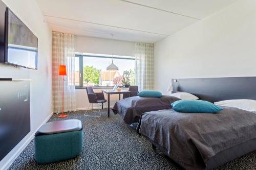 Postel nebo postele na pokoji v ubytování Glostrup Park Hotel