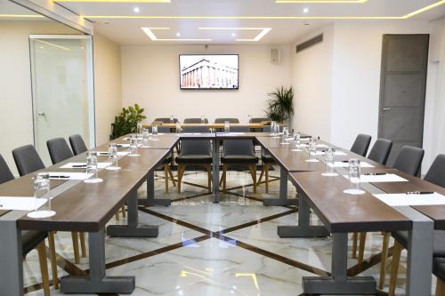 a large conference room with a long table and chairs at Athens Starlight Hotel in Athens