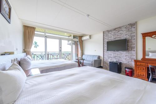 Katil atau katil-katil dalam bilik di Yunlin Gukeng Da-Hu Villa B&B