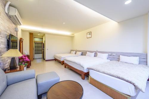 Katil atau katil-katil dalam bilik di Yunlin Gukeng Da-Hu Villa B&B
