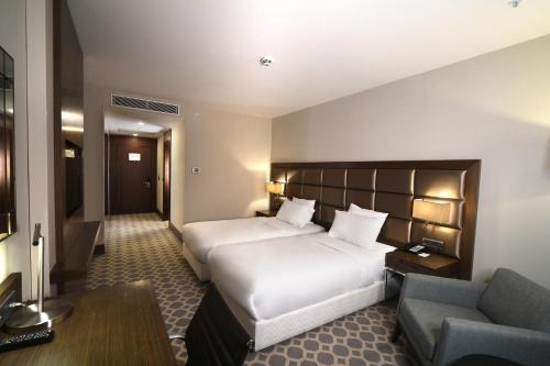 Postel nebo postele na pokoji v ubytování Mercure Istanbul West Hotel & Convention Center