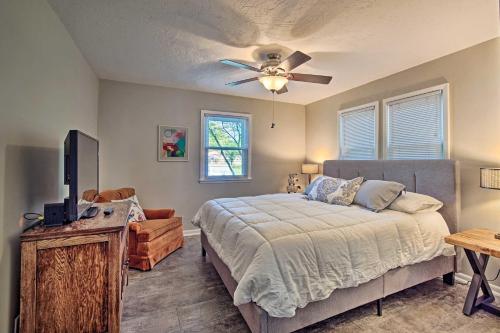a bedroom with a bed and a ceiling fan at Cute Emporia House - Mins to Downtown and ESU! in Emporia
