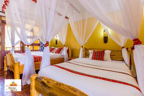 Llit o llits en una habitació de Masai Lodge