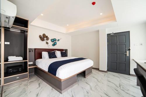 Ένα ή περισσότερα κρεβάτια σε δωμάτιο στο RoomQuest Sukhumvit36 BTS Thonglor