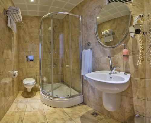 a bathroom with a shower and a sink and a toilet at Fuar Hotel in Istanbul