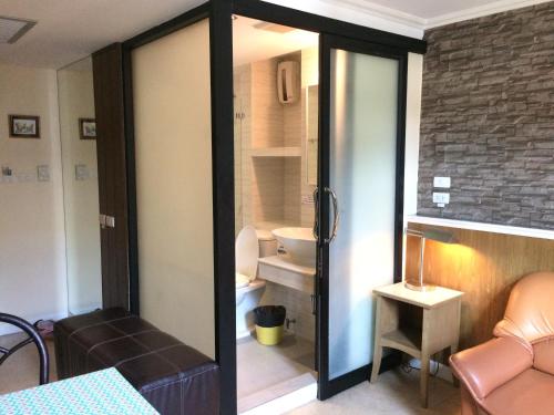 a room with a bathroom with a toilet at Bourbon St. Boutique Hotel in Bangkok