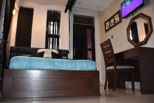 Katil atau katil-katil dalam bilik di Pent House Inn Namugongo