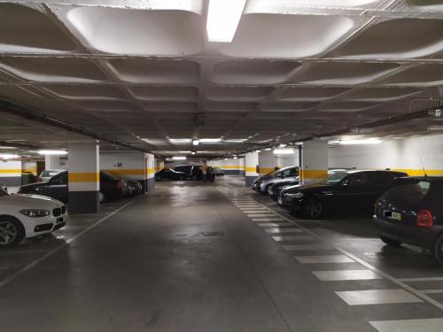 a parking garage with cars parked in it at Lisbon Relax Pool Apartment - Free Parking Garage in Lisbon