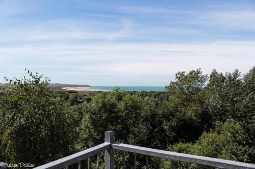 a view of the ocean from a balcony of a house at Hôtel Le Vivier WISSANT - Vue Mer - Côte d'Opale - Baie de Wissant - 2CAPS in Wissant