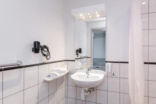 Koupelna v ubytování Grand Hotel Egersund