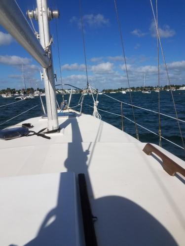 a shadow of a person on a boat on the water at Unique perspective in Miami
