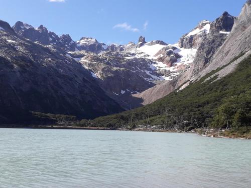 a view of a mountain range with a body of water at Casona Los Arri in Ushuaia