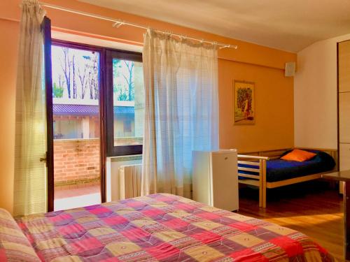 A bed or beds in a room at Maison d'Elite