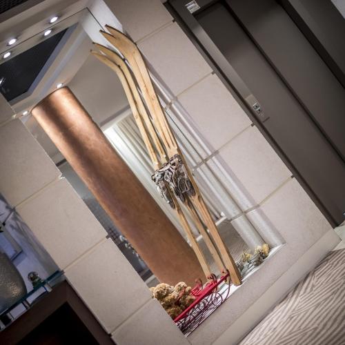 a large mirror in a room with people in a room at Hôtel Le Pré Carré in Annecy