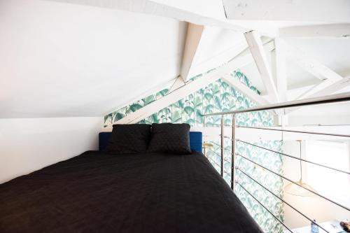 Postel nebo postele na pokoji v ubytování Maison triplex JJ - Ecrin verdoyant au coeur de Lyon