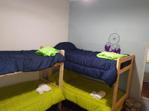 a room with two bunk beds and a clock at Lo de Pablo in Vicente López