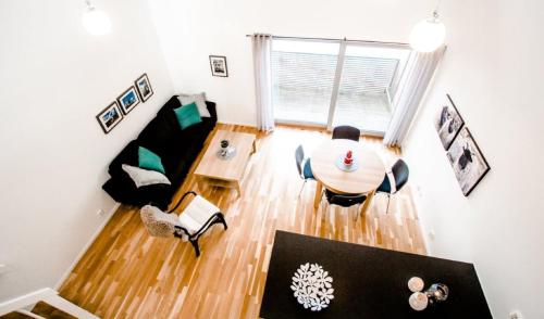 an overhead view of a living room with a table and chairs at Utsira Overnatting - Bølgen in Utsira