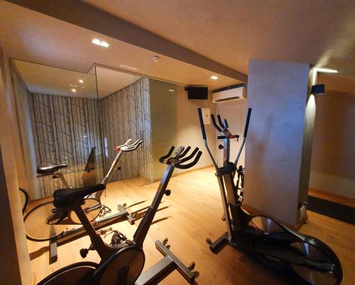 a gym with two exercise bikes in a room at Hotel Villa Real, a member of Preferred Hotels & Resorts in Madrid