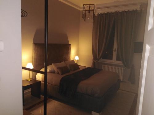 Postel nebo postele na pokoji v ubytování Compasso Suites