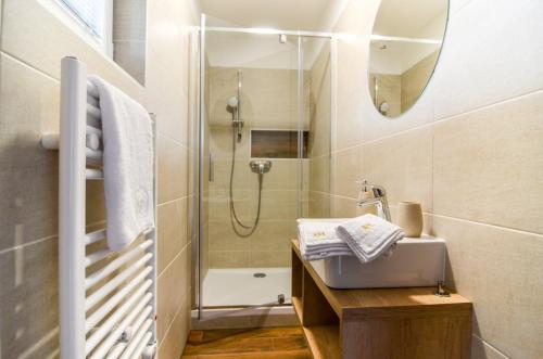 a bathroom with a sink and a shower at Apartmány Milovice in Milovice