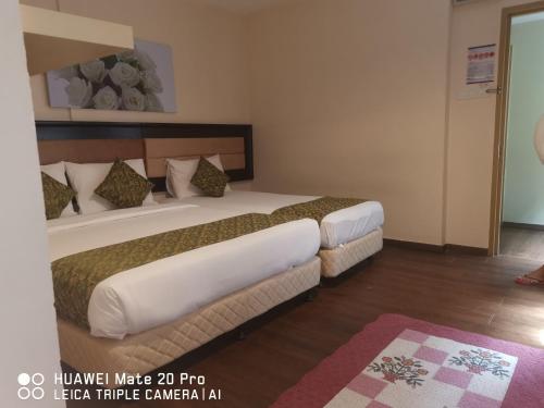 Łóżko lub łóżka w pokoju w obiekcie Yeob Bay hotel Ampang
