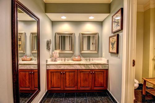 a bathroom with two sinks and a mirror at Cottages and Suites at River Landing in Wallace
