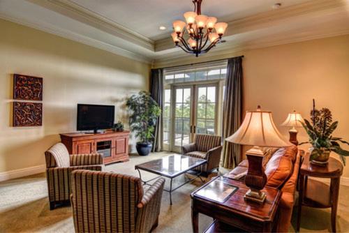 a living room with a couch and a table at Cottages and Suites at River Landing in Wallace