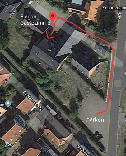a map of a building with a red circle at Landhaus Luttum in Kirchlinteln