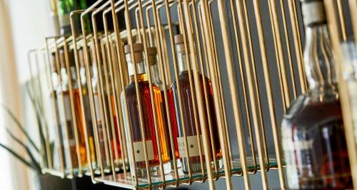 a group of wine bottles in a wine rack at Gl Skovridergaard in Silkeborg