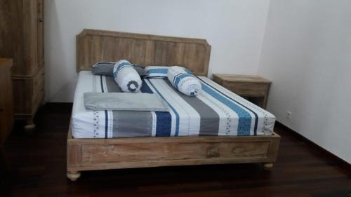 Un pat sau paturi într-o cameră la Villa Ayana Syariah