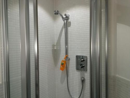 a shower in a bathroom with a glass door at Comfortable and Welcoming Beatrix House by Cliftonvalley Apartments in Bristol