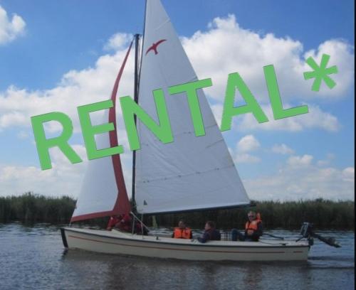 a group of people on a sail boat in the water at Lake house 21 relax accommodation iR Sauna in Warmond