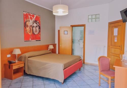 Postel nebo postele na pokoji v ubytování Hotel Piccolo Sogno