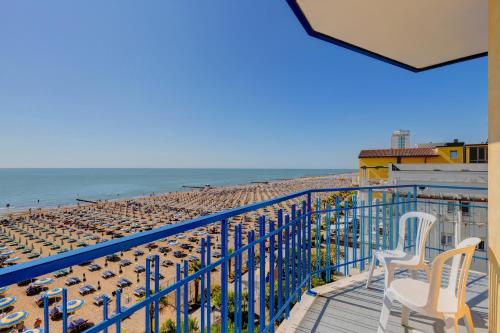 a balcony with a view of the beach at Hotel Napoleon in Lido di Jesolo