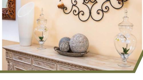 a table with two vases and a bowl with eggs on it at Villa El Retiro Luxury Property in Alajuela City
