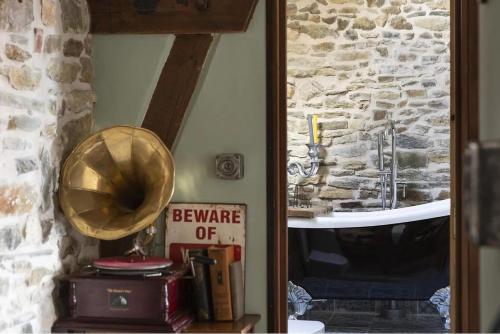 a mirror in a room with a bathroom with a sink at Glatigny Farmhouse - close to beach - proche de la plage in Glatigny