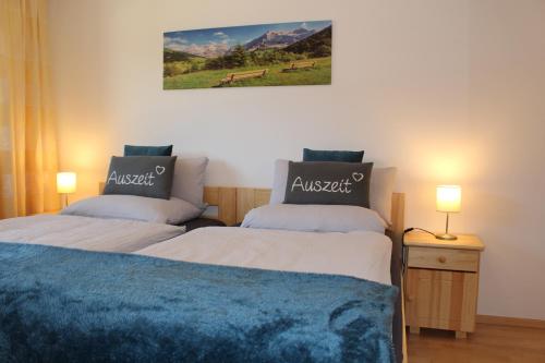 two beds sitting next to each other in a room at Ferienwohnung Auszeit Stubai in Fulpmes